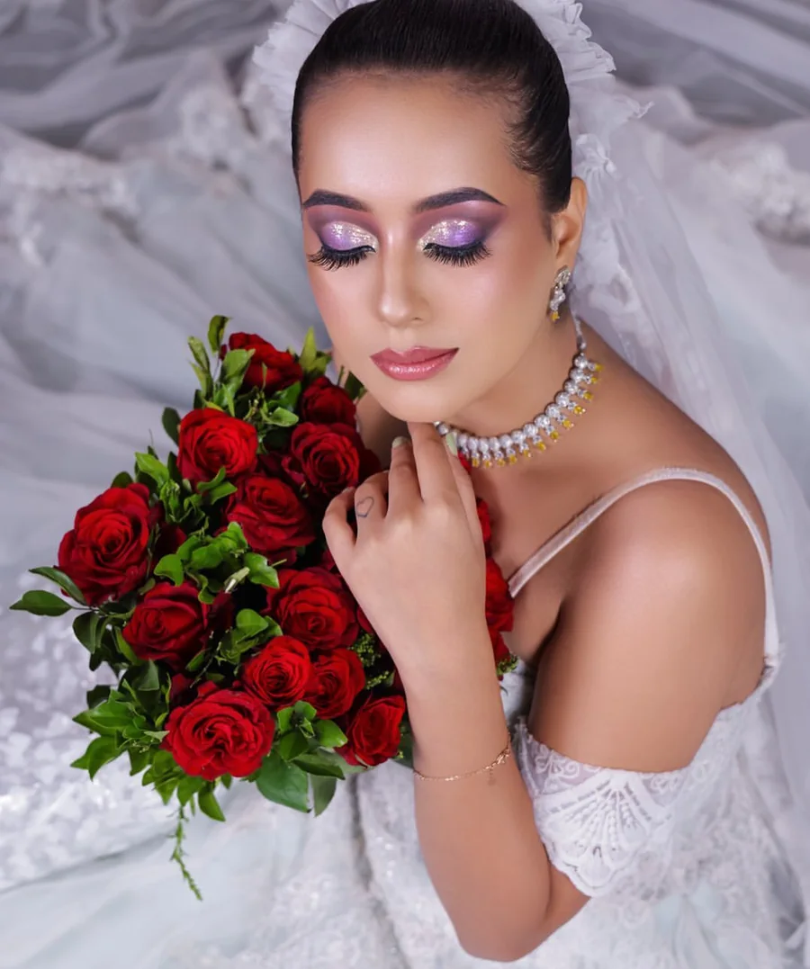 Bridal makeup with violet shimmer eyes and glossy lips
