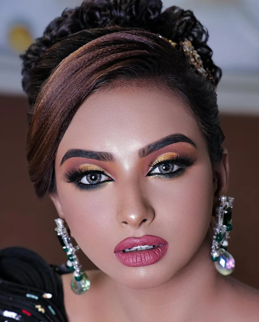Polished makeup look with sculpted brows and statement eyes